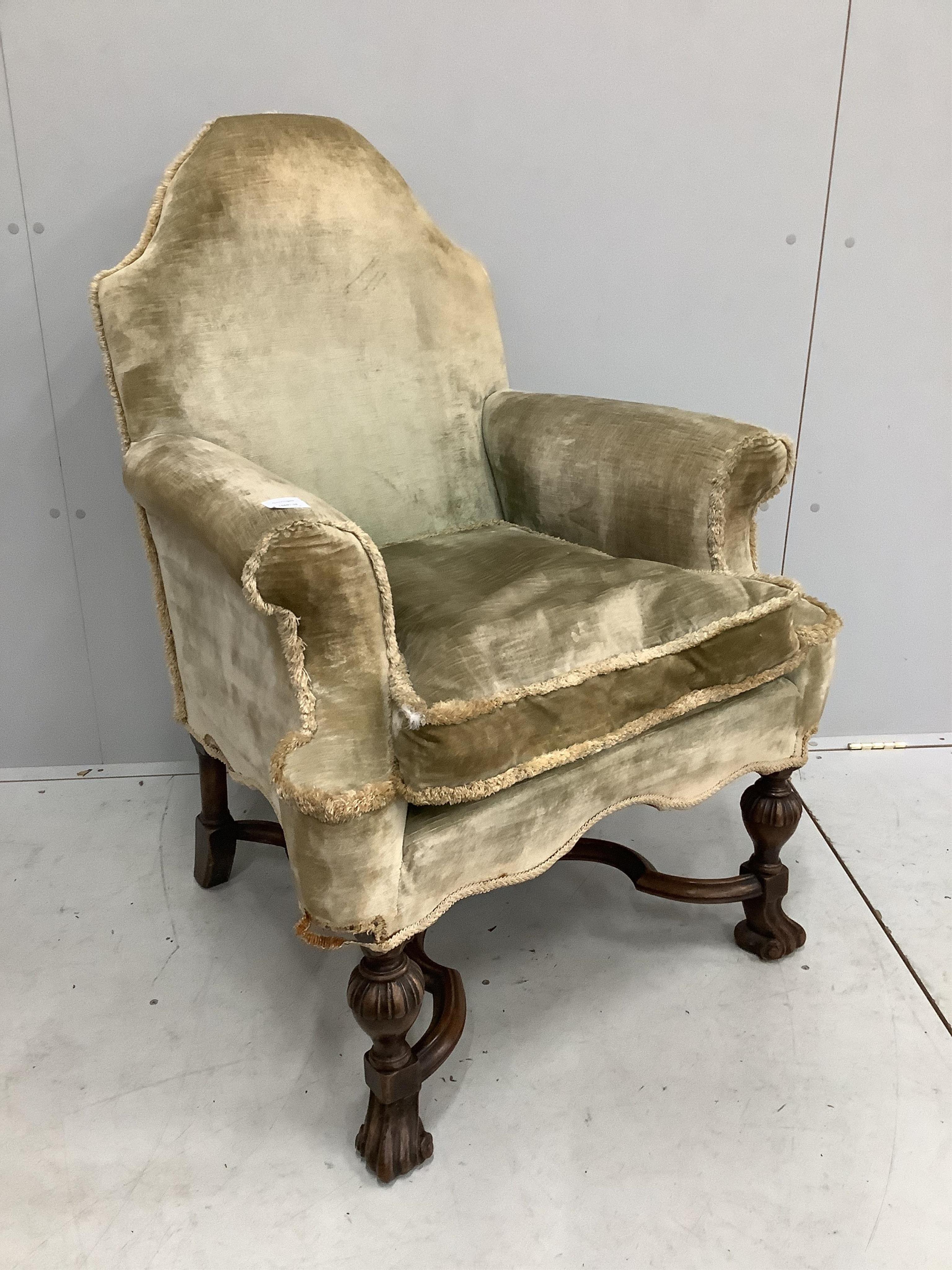 An early 20th century Jacobean Revival gold dralon upholstered armchair, width 78cm, depth 66cm, height 104cm. Condition - fair